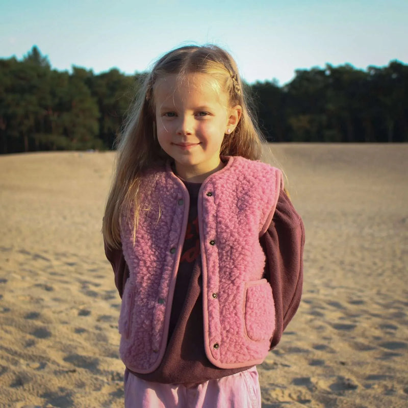 Cocoon enfant, le gilet sans manche en laine mérinos rose poudré