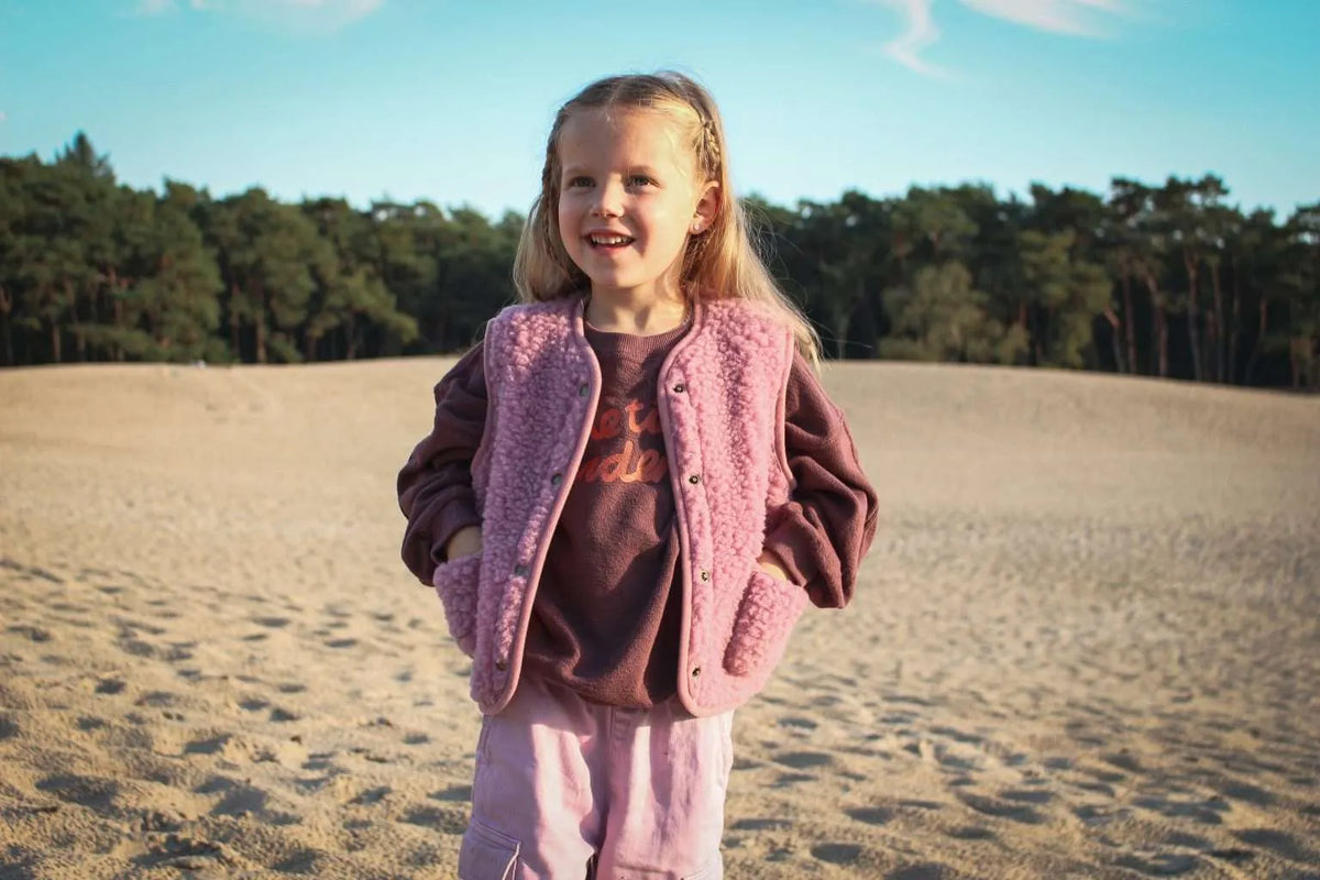 Cocoon enfant, le gilet sans manche en laine mérinos rose poudré